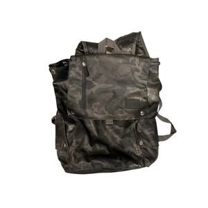 Duchamp flap over camo backpack in charcoal gray and black. Nylon material.